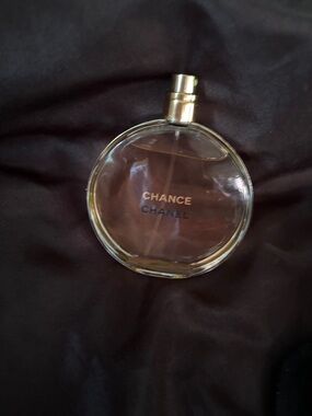 CHANEL Chance Round Perfume Bottle in Clear Glass with Gold Accents